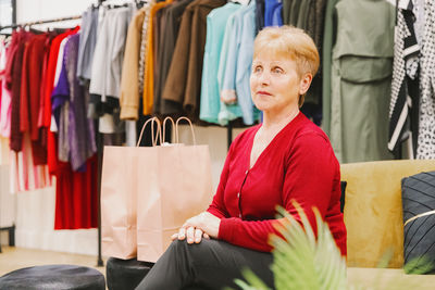 Portrait of young woman sitting at home