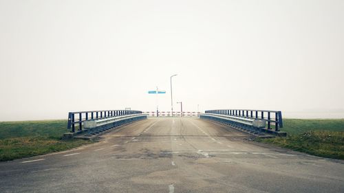 Empty road against clear sky