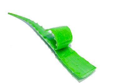 Close-up of green leaf over white background