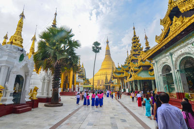 Group of people in temple outside building