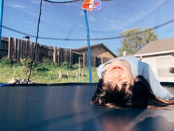 Happy girl on trampoline 