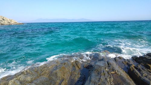 Scenic view of sea against clear blue sky