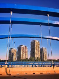 Modern buildings against clear blue sky