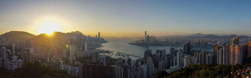 Panoramic view of buildings against sky during sunset