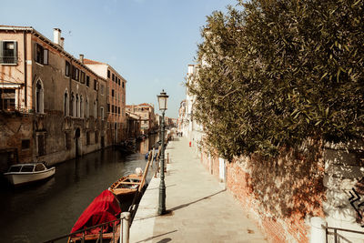 Canal amidst buildings in city