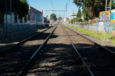 View of railway tracks against buildings