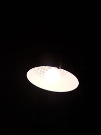 Low angle view of lit light bulb