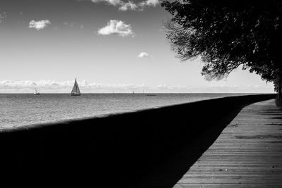 Scenic view of pier by sea against sky