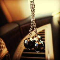 Close-up of chain hanging on metal at home