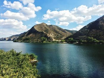 View of lake against cloudy sky