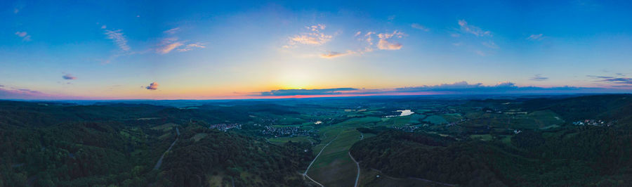 Aerial view of landscape against sky during sunset