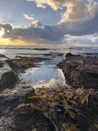 Scenic view of sea against sky during sunset