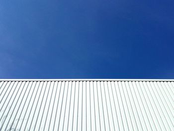 Low angle view of building against blue sky