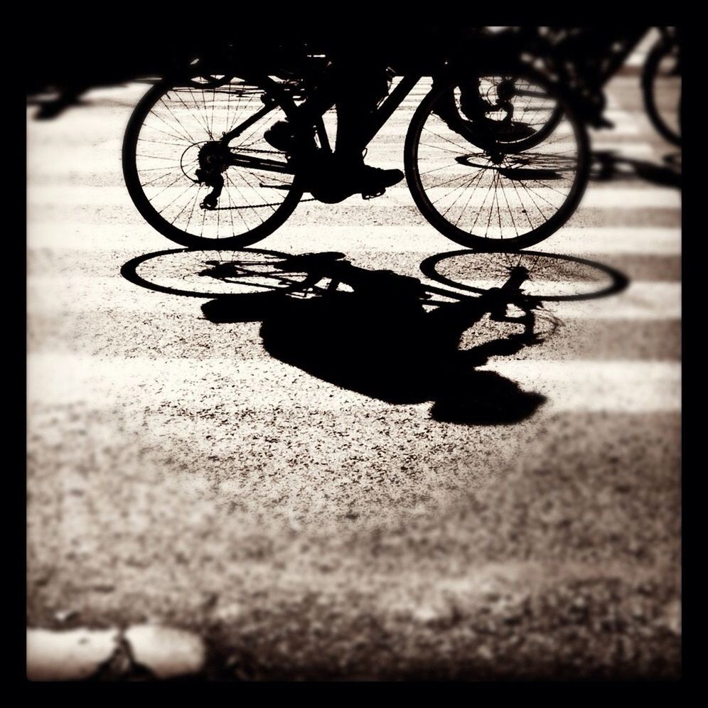 bicycle, transportation, mode of transport, land vehicle, stationary, transfer print, wheel, auto post production filter, street, parking, parked, shadow, sunlight, car, outdoors, travel, day, motorcycle, road, riding