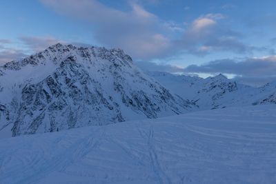 Scenic view of snowcapped mountains against sky