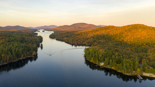 Scenic view of lake against sky during sunset