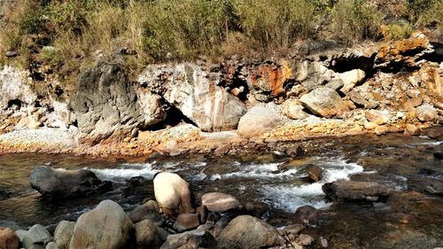 River flowing through rocks in forest