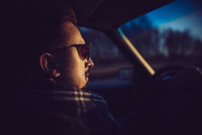 Close-up of man in car