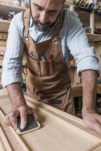 Carpenter working in workshop