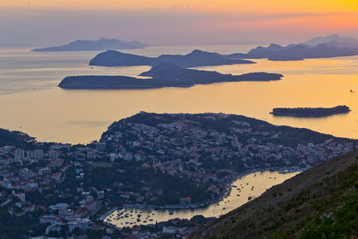 High angle view of town and adriatic sea during sunset