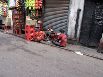 Toy car on footpath by street in city