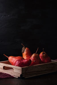 Close-up of fruits against black background