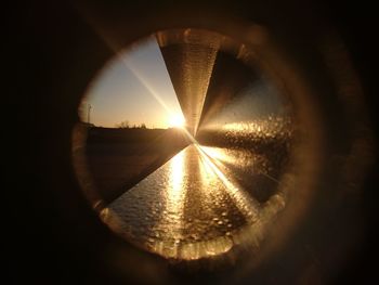 Close-up of reflection of sun in water