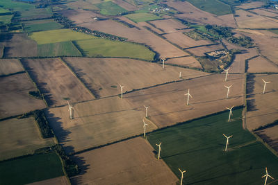 Aerial view of windmills on landscape