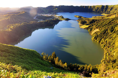 Scenic view of lake amidst landscape at azores during sunset