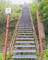 High angle view of text on metal railing