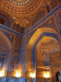 Low angle view of illuminated ceiling of building