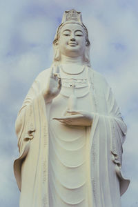 Low angle view of statue against sky