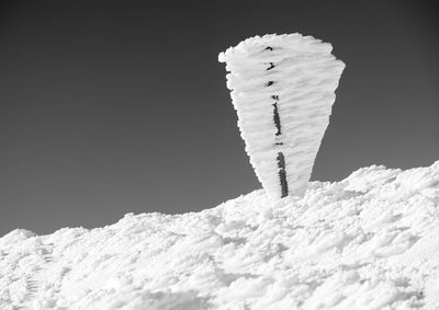 Close-up of frozen ice against sky