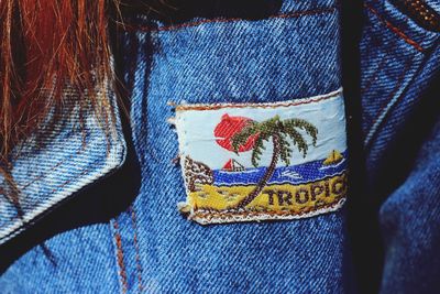 Close-up of textile patch on denim jacket