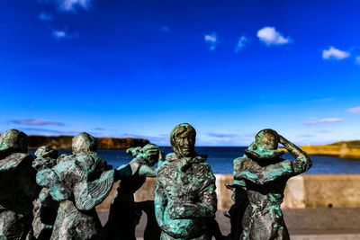 Statue against blue sky