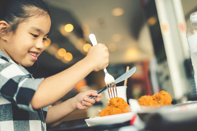 Midsection of boy holding ice cream