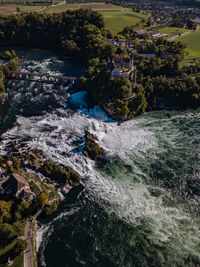 Scenic view of river flowing through rocks