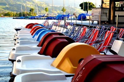 Multi colored moored boats in water