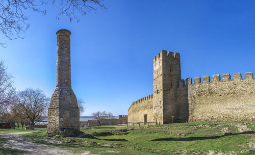 Low angle view of castle against clear blue sky