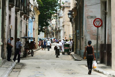 People walking on street in city