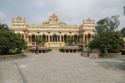 Facade of historic building against sky