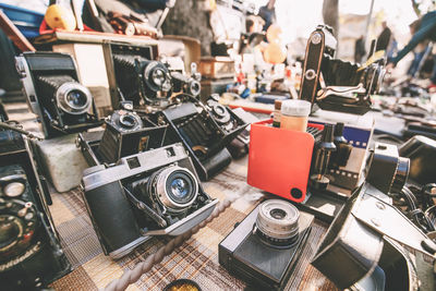 Close-up of vintage cameras for sale on table