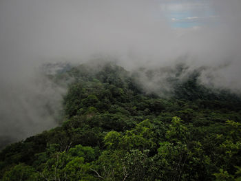 Scenic view of mountains against sky during foggy weather