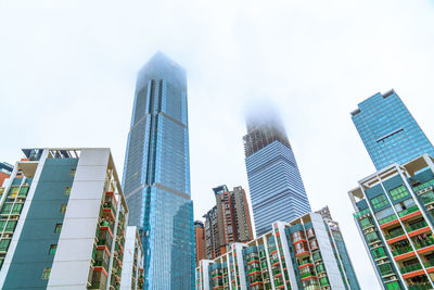 Low angle view of modern buildings against sky