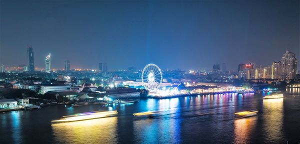 Illuminated buildings in city at night