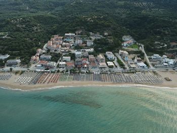 High angle view of buildings by sea