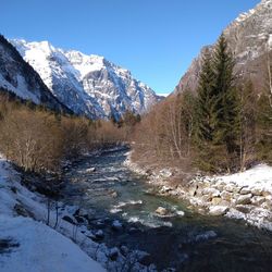 Scenic view of snow covered mountains against sky