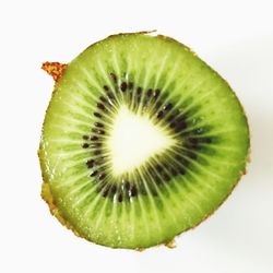 Close-up of lemon slice over white background