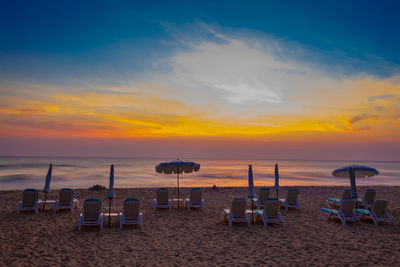 Scenic view of beach against sky during sunset