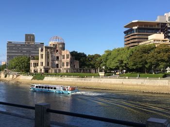 High angle view of barge sailing on river by hiroshima peace memorial